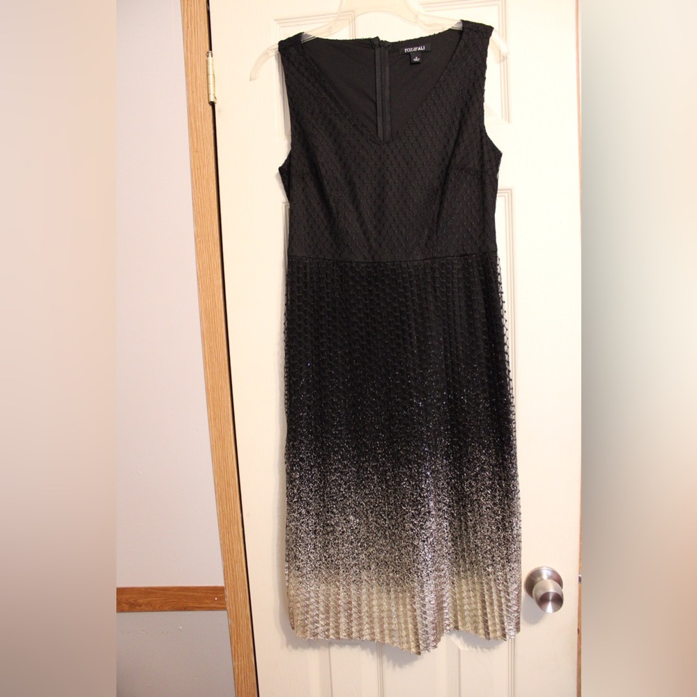Golden gradient detail at the bottom of the dress. V cut neckline